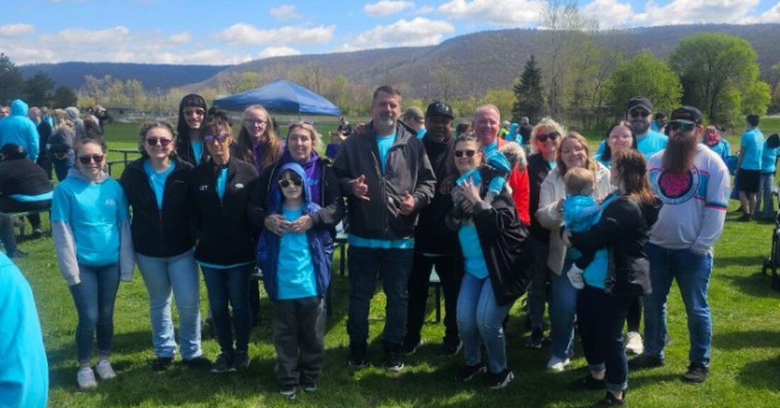 Employees step up for Walk a Mile in My Shoes event